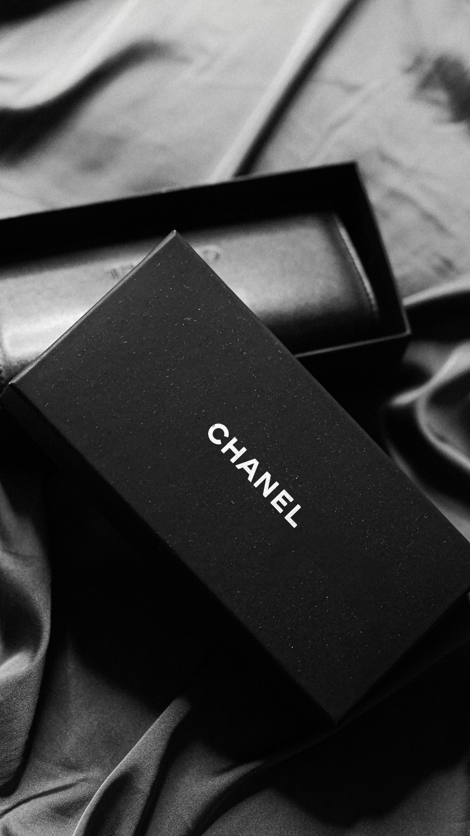 A dark geometric object on a black surface
